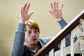 Rupert_Grint_(Tony)_looking_over_the_banisters_with_his_hand.jpg