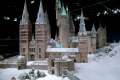 Interactor_Chelsea_Carter-Crosby_adds_some_of_the_last_sprinkles_of_snow_onto_the_Hogwarts_model_at_Warner_Bros_Studio_Tour_(5).jpg